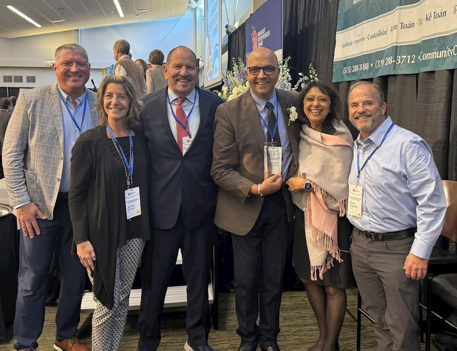 Manish Nathwani poses with SHAZAM leadership after receiving IES Immigrant Spirit Award