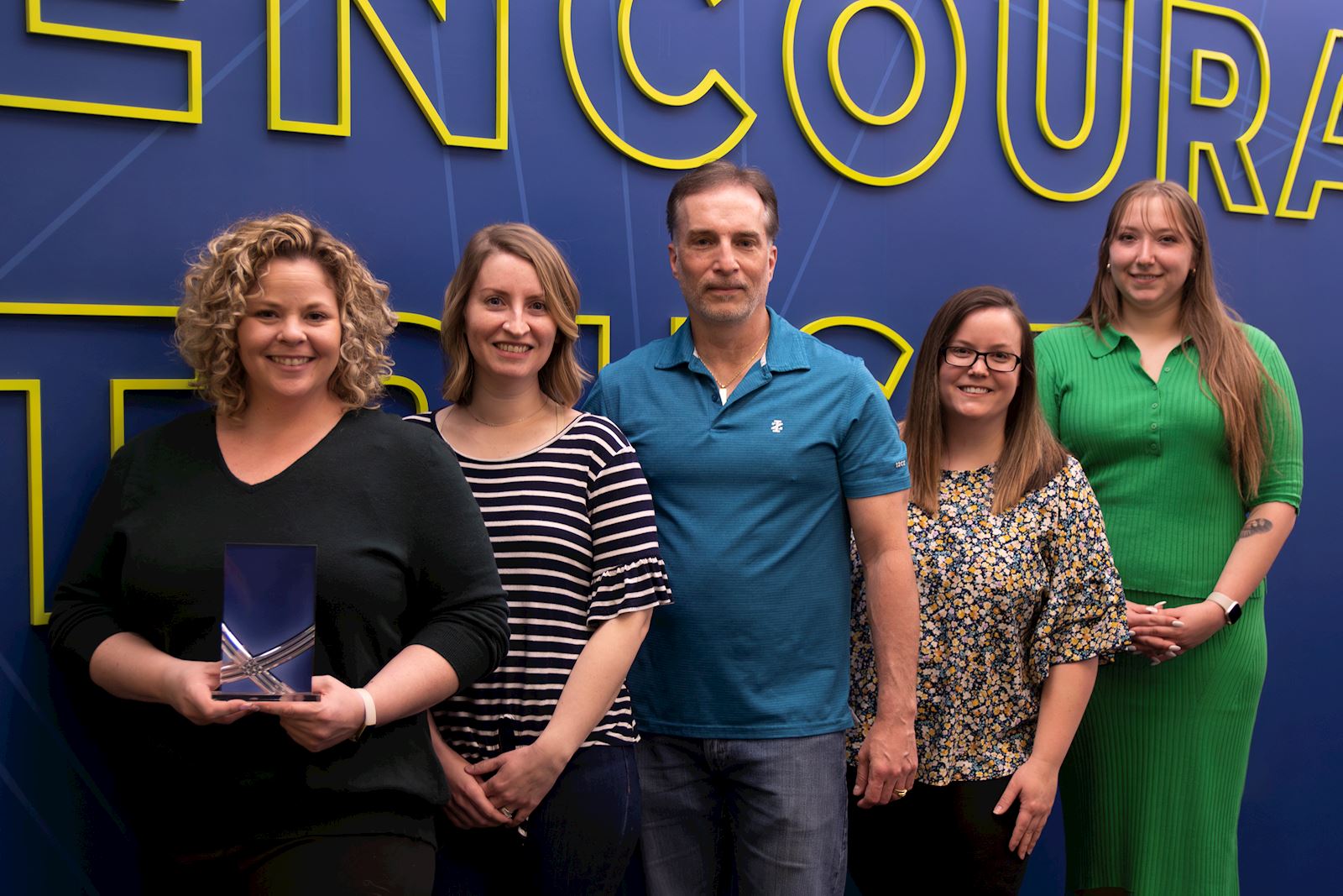 Members of the SHAZAM CARES United Way team presented with a LIVE UNITED Champion Award