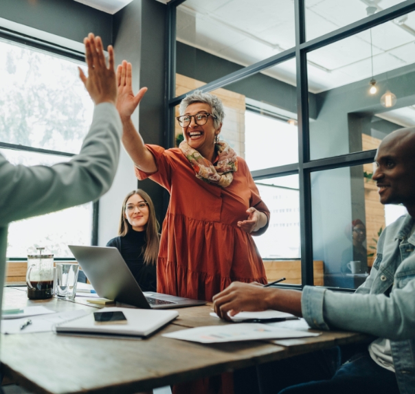 woman high fiving in office