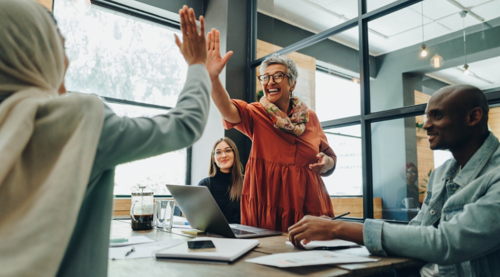 woman high fiving at office