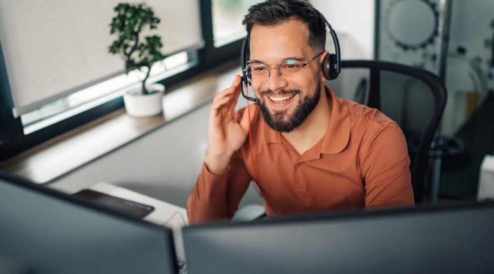 man on laptop in customer service