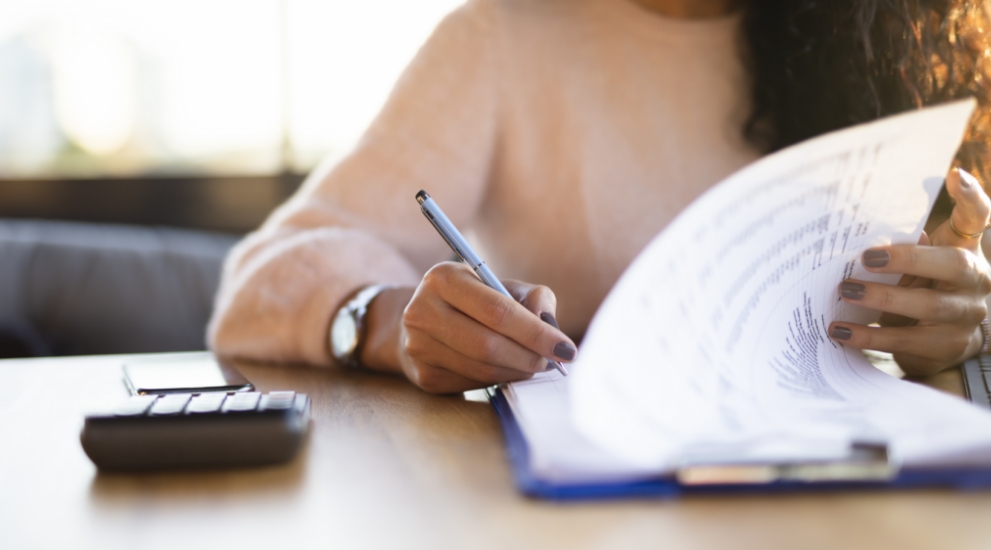 woman writing claim