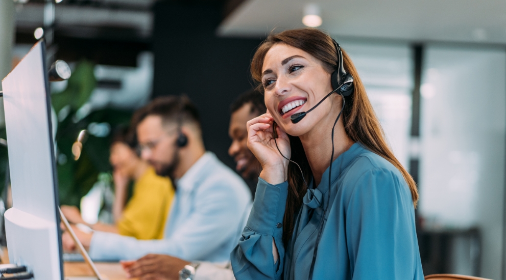 woman on headphones in office