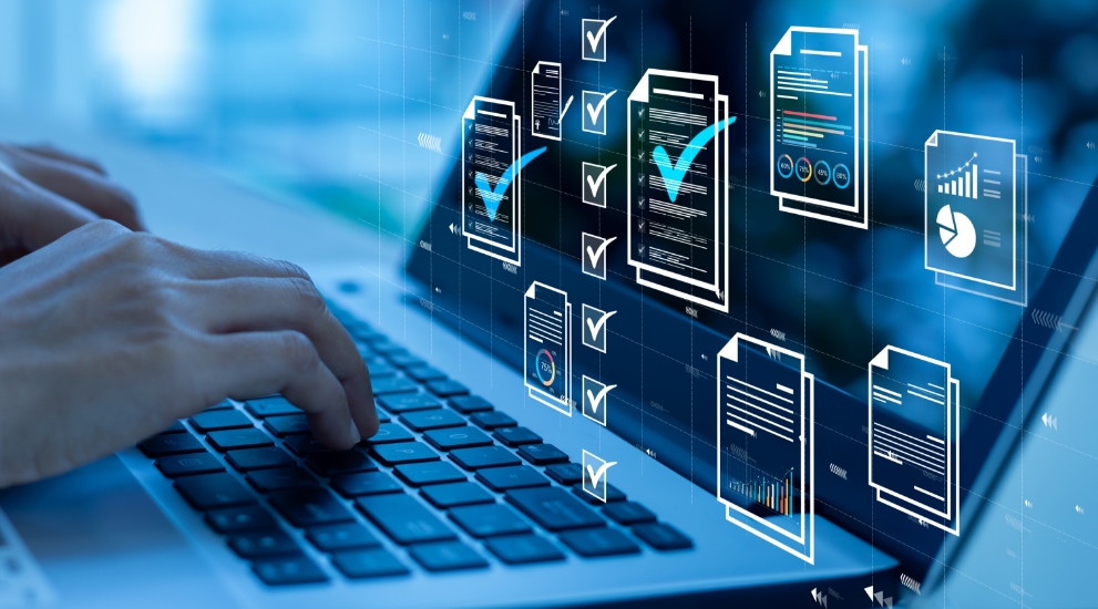 person on laptop with document icons