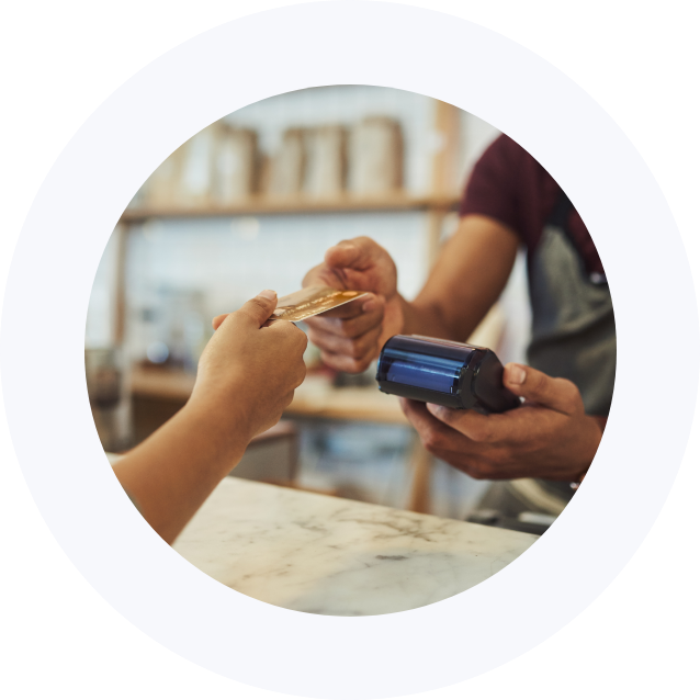 Two people using debit card and check out device